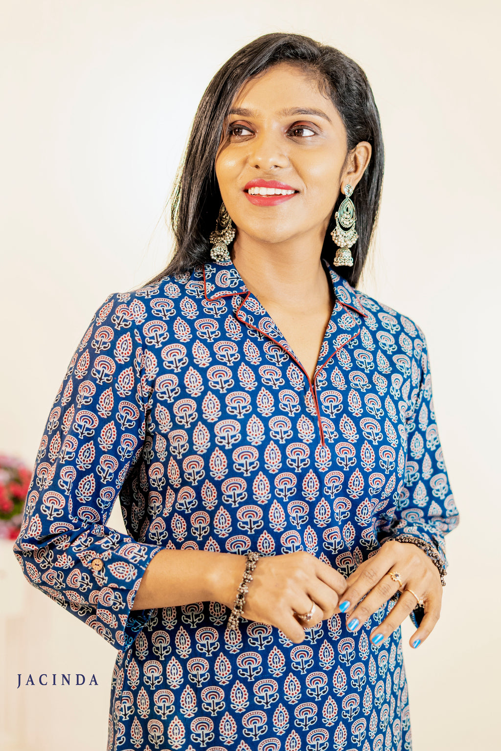 Ajrakh print ethnic indigo slitted kurti styled with earrings for a chic look