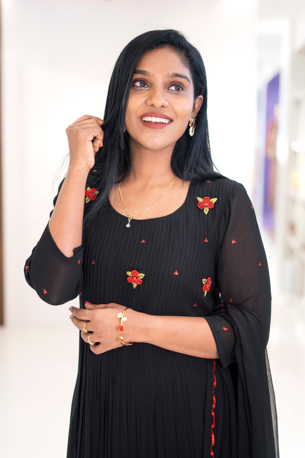 Elegant black georgette embroidered dress featuring floral designs and a flowing A-line silhouette