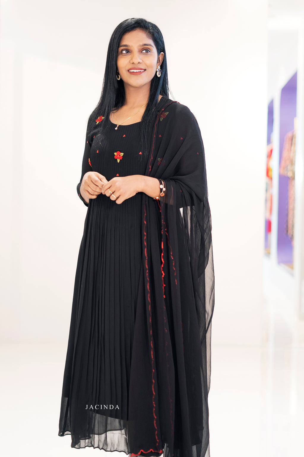 Elegant black georgette embroidered dress by Jacinda with floral details and pleated skirt
