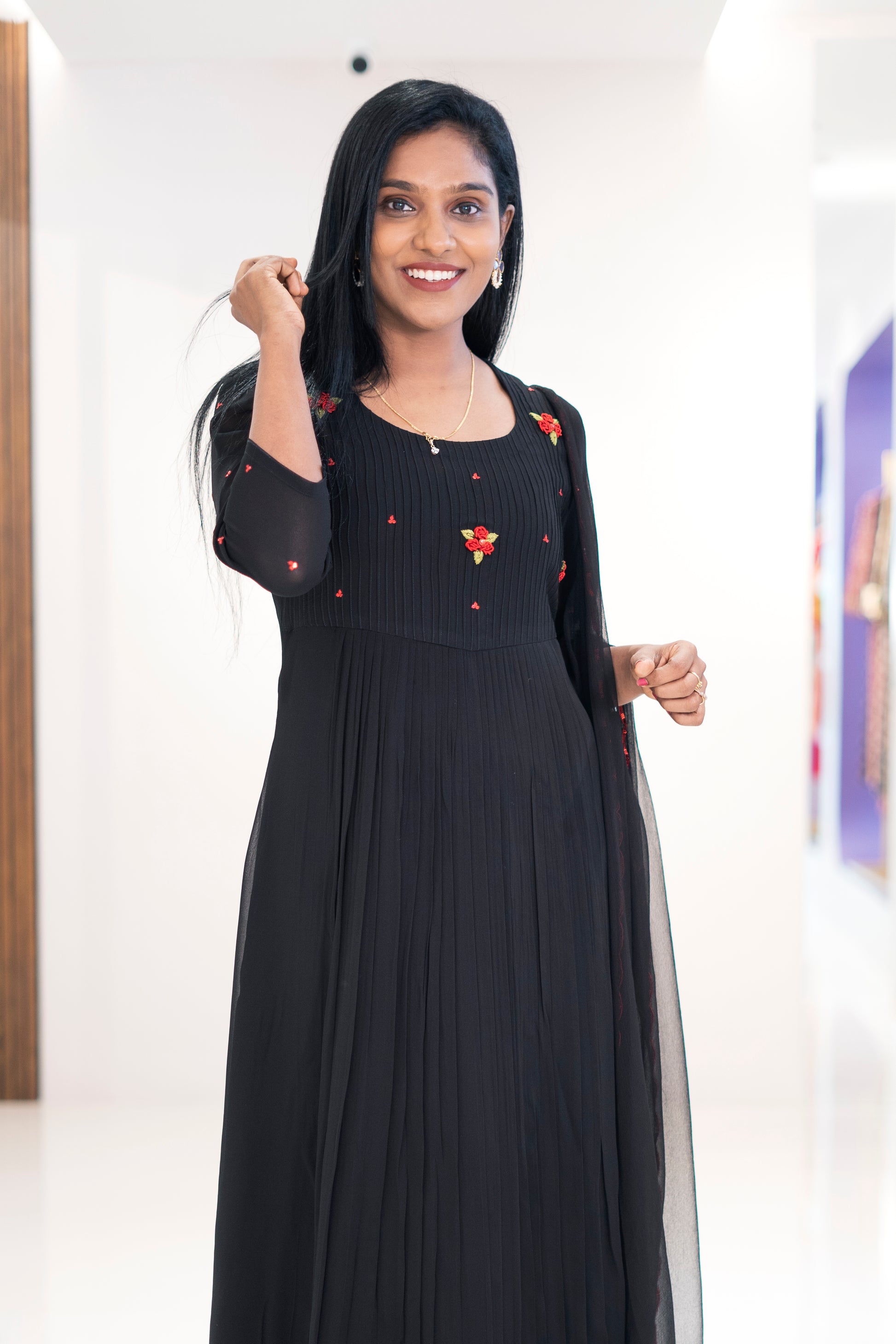 Jacinda black georgette embroidered dress with floral designs and pleated detail for elegant occasions