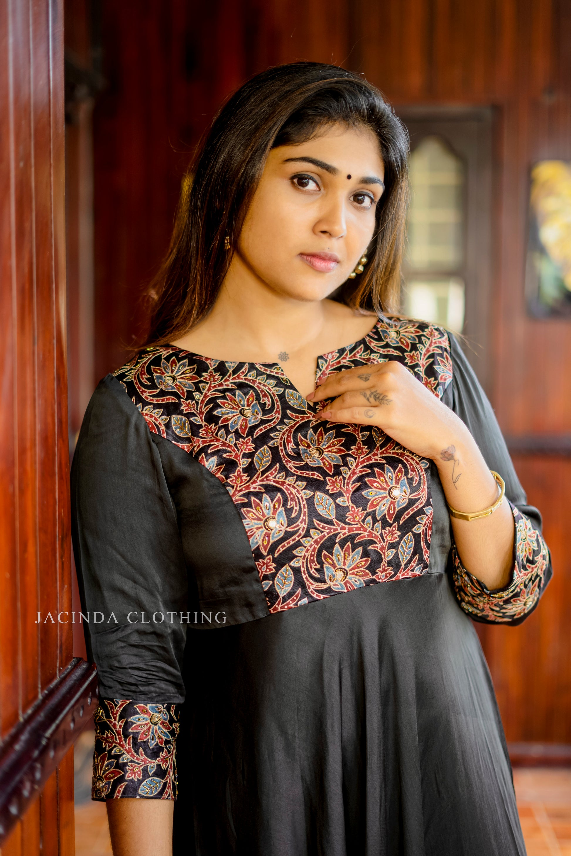 Elegant women's black modal aline dress with intricate floral embroidery and comfortable fit