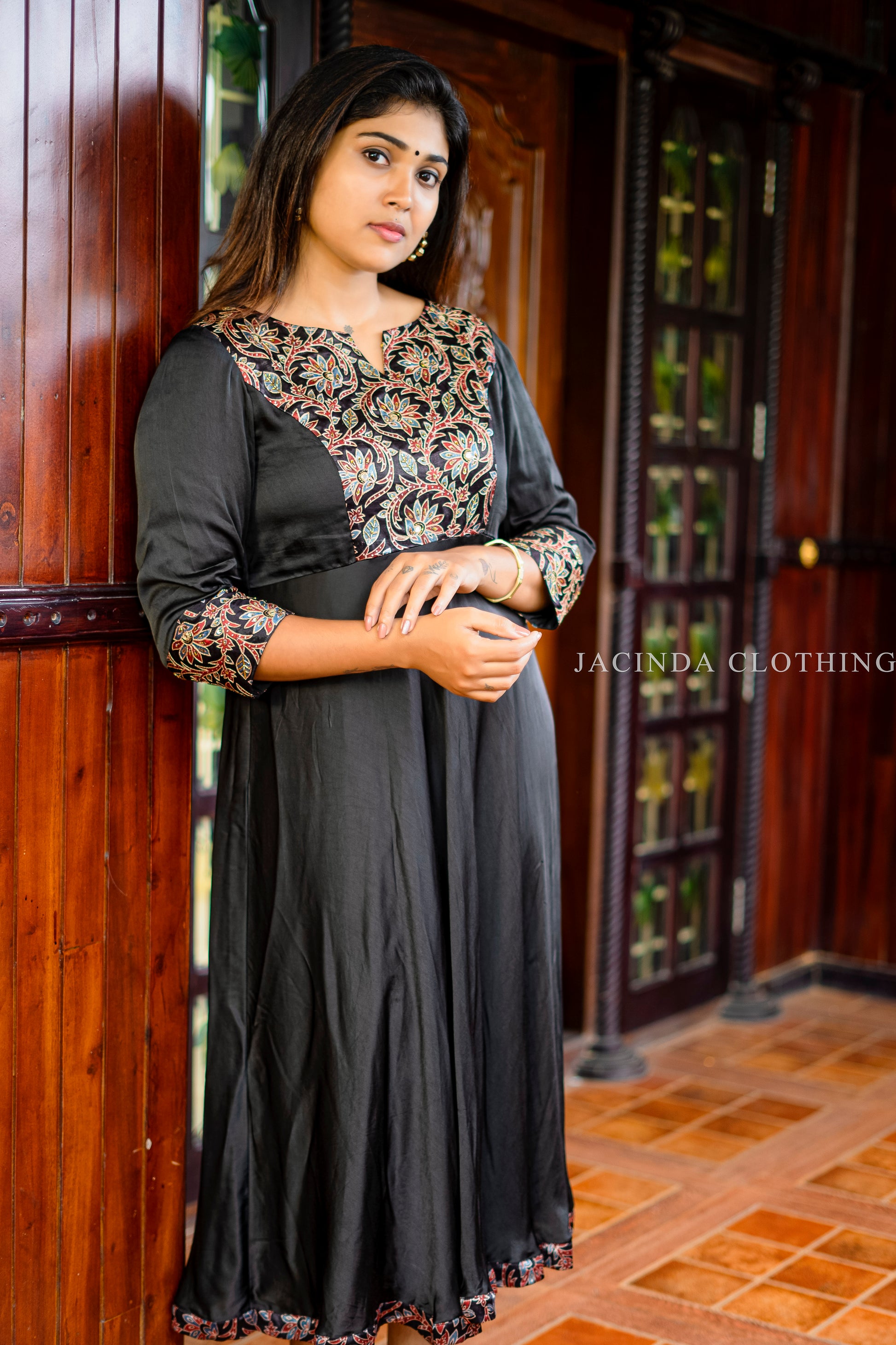 Stylish women's black modal aline dress with floral embroidery and three-quarter sleeves