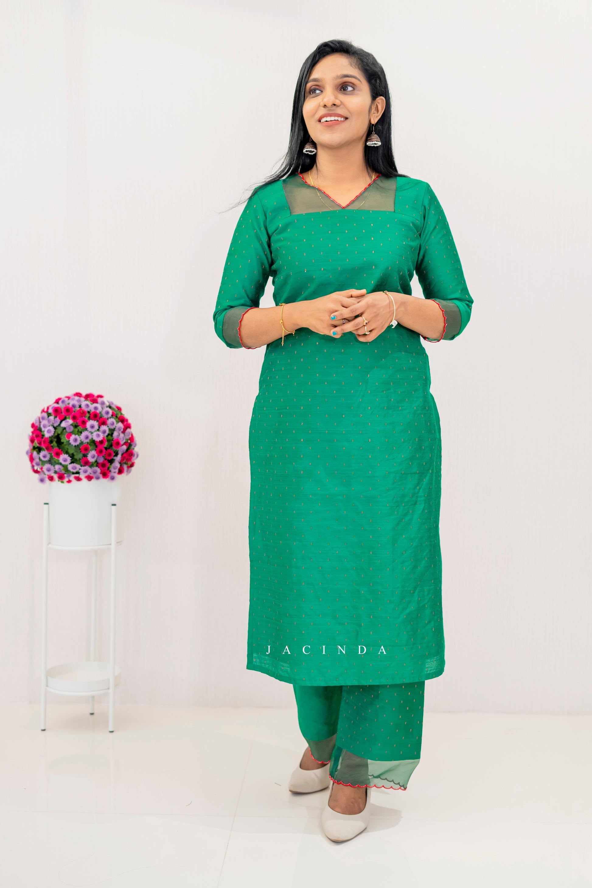 Stylish green cotton party wear set for women featuring a kurta and pants with elegant design
