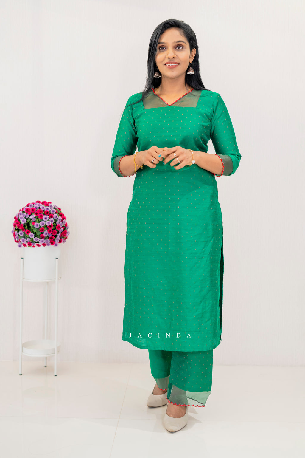 Elegant green cotton party wear set for women featuring a stylish kurta and matching pants