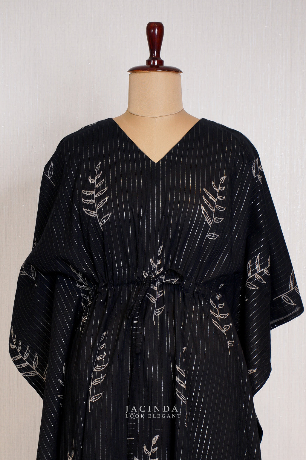 Jacinda Women's V-NECK Kaftan Dress in black with leaf print and cinched waist for a stylish look